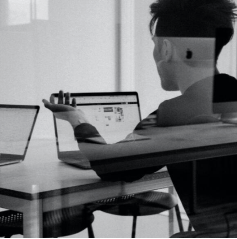 Consultant reviewing funding applications on a laptop
